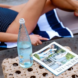 Atlantic Beach House a bottle of water next to a magazine