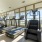 Fitness center with ample machines and natural light