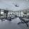Fitness center with ample machines and natural light