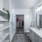 Spacious bathroom with dual sinks and built-in shelving