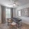 large bedroom with at home working area with desk and chairs 