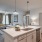 Kitchen with island and stainless steel appliances in luxury Mount Pleasant apartment community. 