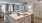 Kitchen with island and stainless steel appliances in luxury Mount Pleasant apartment community. 